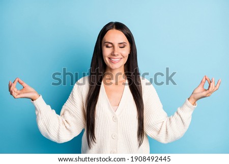 Photo of pretty positive person closed eyes fingers meditate smile isolate don blue color background