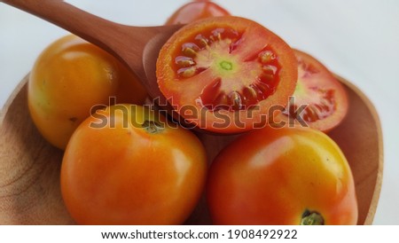 fresh shinny tomatoes, for healthy meal and drink. Slice and cut, view seed