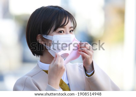 Image of a woman wearing a mask