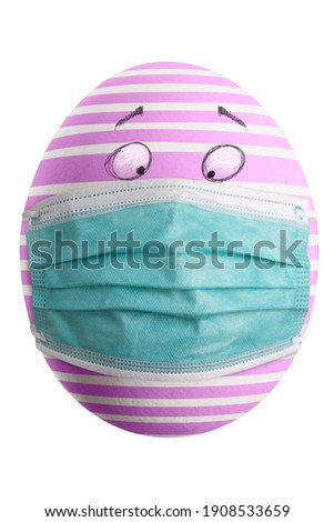 Large picture of an isolated easter egg with a stripes  mask and eyes.
