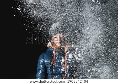 A picture in the evening of a girl in snowy frosty weather