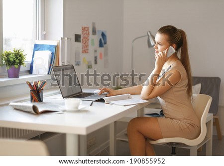 indoor picture of smiling woman with documents