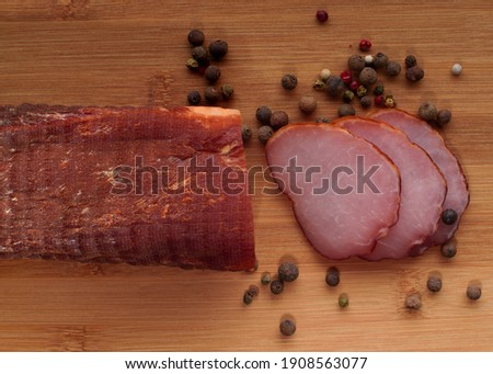 Traditional smoked pork fillet, salted and very tasty. Royalty-Free Stock Photo #1908563077
