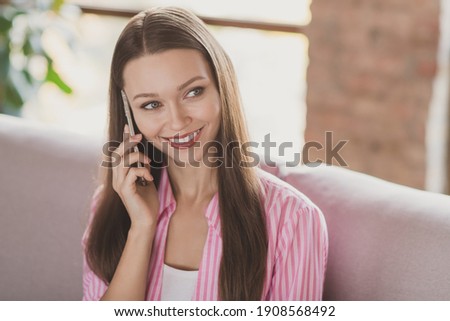 Photo of charming attractive brunette young woman hold talk phone break pause good mood inside home indoors