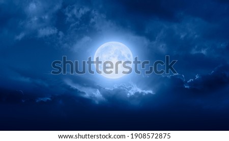 Night sky with full bright moon in the clouds "Elements of this image furnished by NASA" Royalty-Free Stock Photo #1908572875