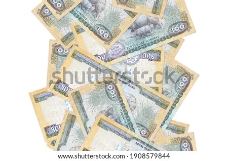 100 Nepalese rupees bills flying down isolated on white. Many banknotes falling with white copy space on left and right side