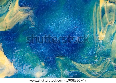 Liquid art gel background. Abstract textured neon background of slime. Macro photo of slime toy for kids.