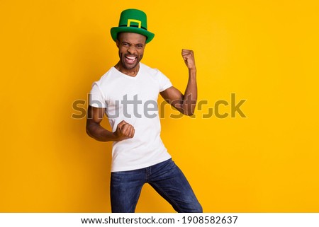 Portrait of his he nice attractive ecstatic cheerful cheery guy wearing festal hat celebrating attainment isolated over bright vivid shine vibrant yellow color background