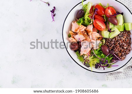 Salmon salad. Fresh salad with grilled salmon, avocado, cherry tomatoes, lettuce, quinoa, olive and microgreens. Homemade food. Concept healthy meal. Top view, flat lay.