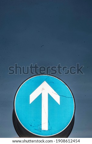 direction arrow points in one way, sign to move towards this direction