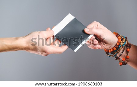Black blank Bussines cards in hands. in Womens hands, in mens hands. With shadow. Top, front, side view. photo shoots. man woman company b-cards