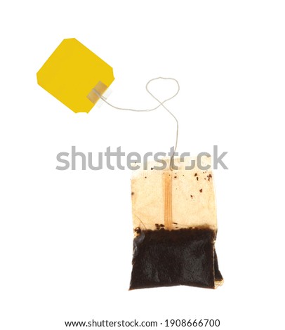 Used tea bag with tag isolated on white