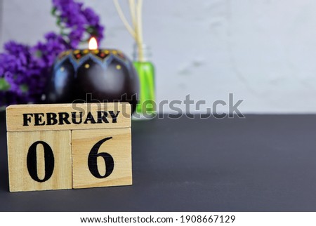 Day 6 of february month, Wooden calendar with date. Empty space for text.