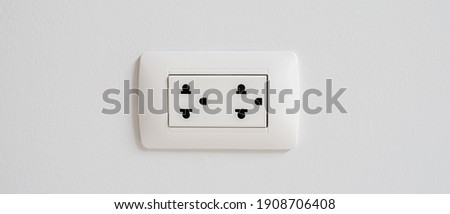 Electrical power socket plug outlet on concrete white wall. copy space banner.