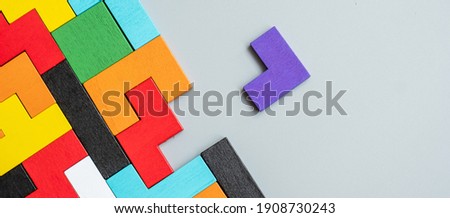 geometric shape block with colorful wood puzzle piece background. logical thinking, business logic, Conundrum, decision, solutions, rational, mission, success, goals and strategy concepts Royalty-Free Stock Photo #1908730243