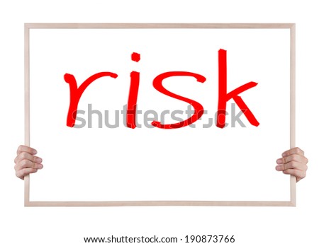 risk on whiteboard with hands