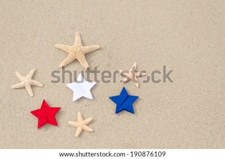 American holidays background on the sandy beach near the ocean