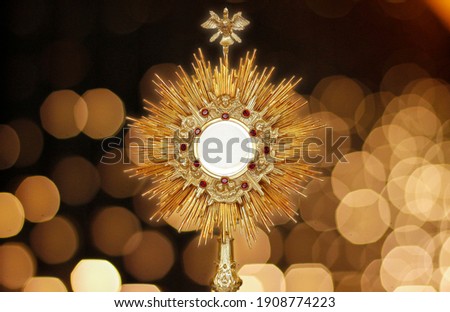 Ostensorium for worship at a Catholic church ceremony - sacred object of devotion and exposure of the Blessed Sacrament Royalty-Free Stock Photo #1908774223