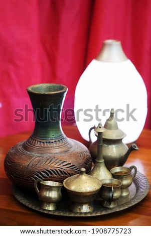 Selective focus of Vintage Copper Vase. Copper Decor, Ornamental Object , Carving Art Vase, Mid Century.