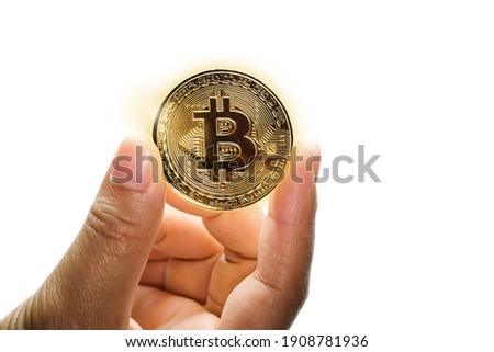 Hand holding Gold bitcoin on white background