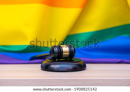 Rainbow flag and wooden gavel for judge lawyer, concept picture about human rights 