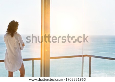 Photo of attractive woman enjoying balcony view at home Royalty-Free Stock Photo #1908851953