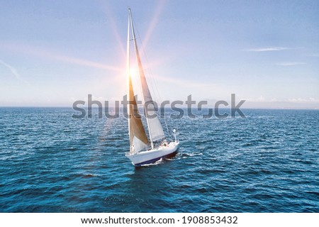 Photo of sailboat sailing on ocean Royalty-Free Stock Photo #1908853432