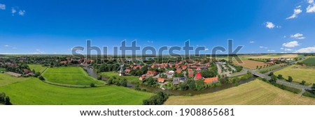 Drone view, city shot with the twin mills at the old Greetsieler Sieltief. Cuxhaven in Lower Saxony in Germany Royalty-Free Stock Photo #1908865681