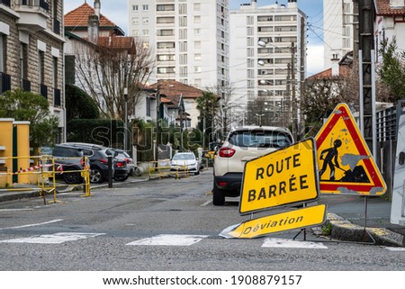 Road closed, diversion and road work signs in French town