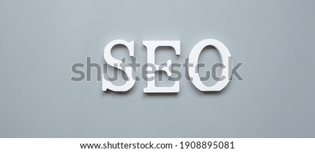 SEO (Search Engine Optimization) text on gray background. Idea, Vision, Strategy, Analysis, Keyword and Content concept