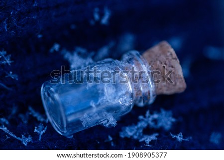 The snowflake is preserved in a small jar
