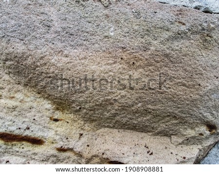 Sandstone texture. Grungy grainy background. Solid building material.
