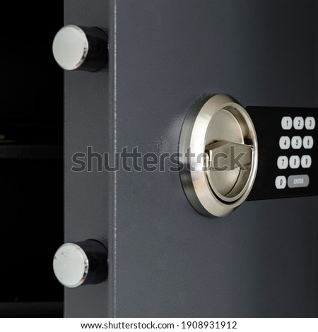 The door of the safe for money and securities with a digital lock