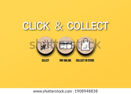 click and collect concept with symbols on round wooden discs on orange background, buying online and picking up in local store