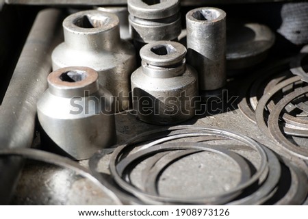Industrial photography. Aesthetics of mechanical products made of ferrous metals. Work on displaying the interior, exterior of industrial facilities; Gear bushing and other auto parts.