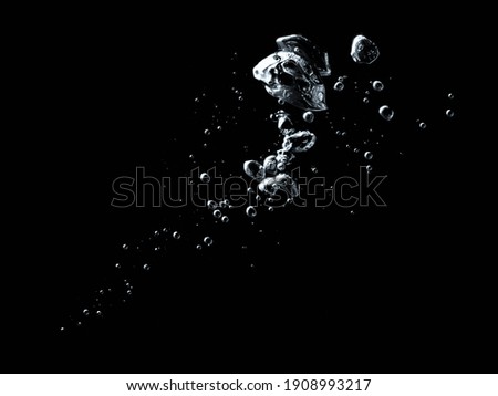 Underwater Bubbles on Black Background Royalty-Free Stock Photo #1908993217