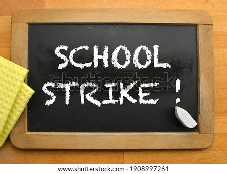 Blackboard with written information school strike