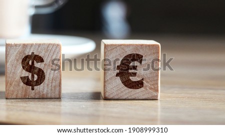 euro and dollar on wooden blocks sign concept. EU word currency business concept.