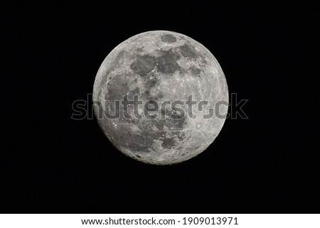 A picture of the full moon about 98% illuminated.