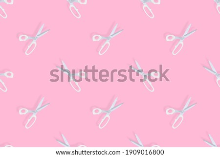 Scissors seamless pattern. Barber scissors on a pink background. 