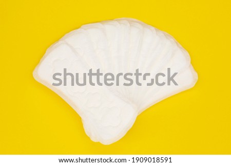 napkin or sanitary pad for intimate hygiene on a yellow background