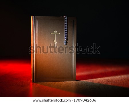 Bible icon on leather book. Bible with a picture of cross. Concept - study of religious literature.