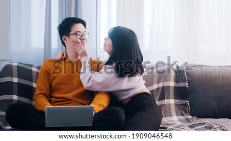 Young woman distracting her boyfriend from working. Remote work disadvantages. High quality photo