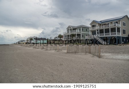 Row Of Beach Houses On Edisto Island, South Carolina. Royalty-Free Stock Photo #1909125751