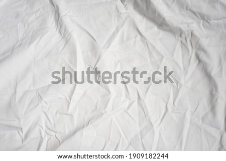 blank crumpled white bedsheet for background Royalty-Free Stock Photo #1909182244