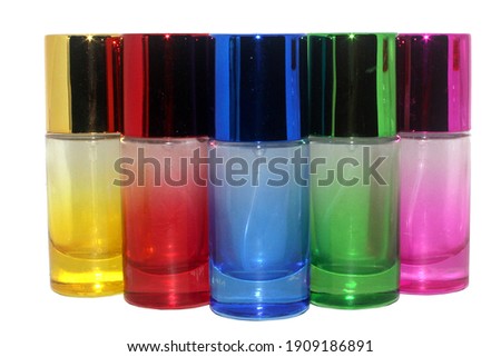 Colorful perfume bottle set on isolated white background