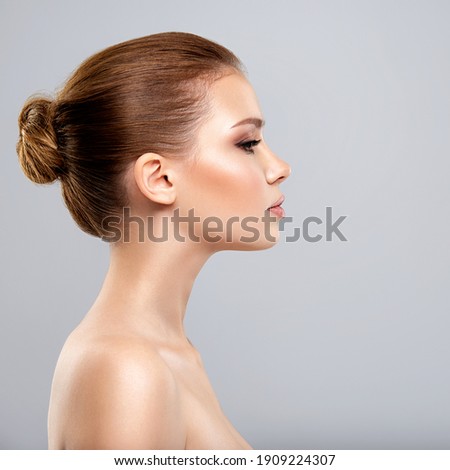 Profile face of  young  woman - isolated. Profile portrait of a  face of the young pretty girl.  Skin care concept.  Royalty-Free Stock Photo #1909224307