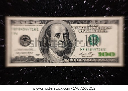 100 dollar banknote on black glitter background