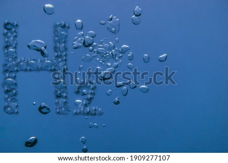 hydrogen h2 with many air bubbles in blue water Royalty-Free Stock Photo #1909277107
