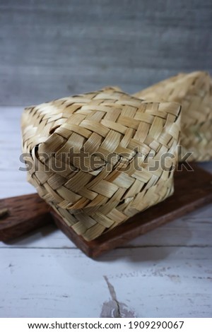 Unfocus picture of "Besek" traditional place or container made of woven bamboo, the shape of a rectangle. Isolated